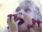 kid with raspberries